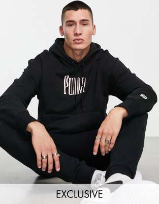 фото Oversized-худи черного цвета с розовыми элементами puma downtown – эксклюзивно для asos-черный цвет