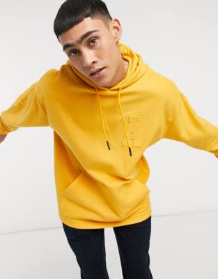 фото Oversized-худи из плотного флиса с тисненым логотипом asos actual-желтый