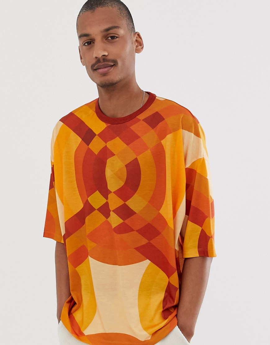 Oversized T-shirt med all-over abstrakt print fra ASOS DESIGN-Orange