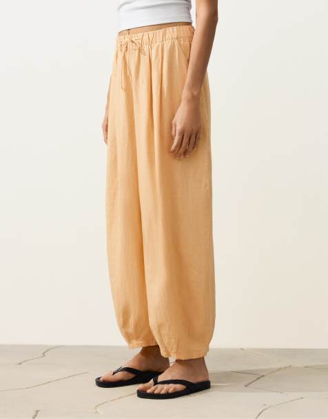 OYSHO 100% linen pleated balloon trousers in yellow - view 1