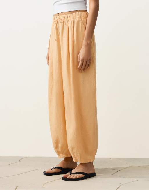 OYSHO 100% linen pleated balloon trousers in yellow, 2 of 4