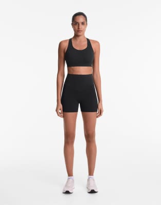 OYSHO 10cm compressive pocket high rise hot pants in black