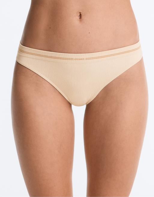 OYSHO 3 seamless rib polyamide blend thongs in off-white, 2 of 4