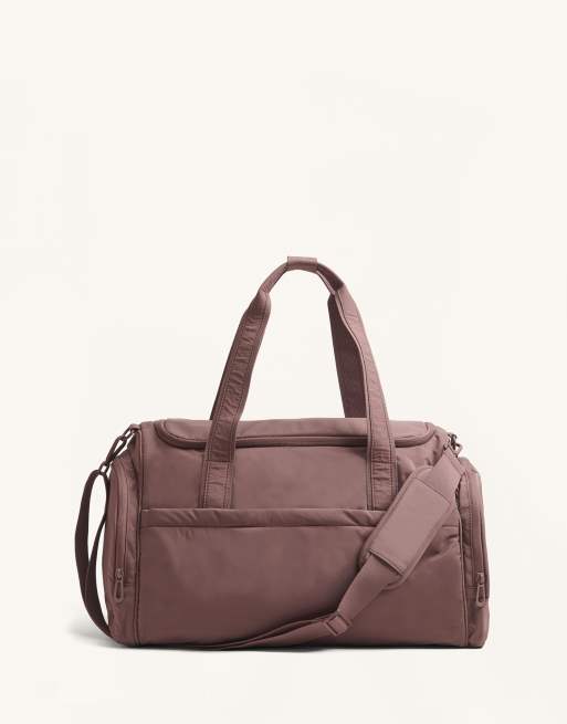 OYSHO - Borsa sportiva color malva con tasche laterali