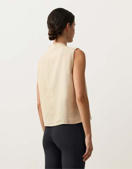 OYSHO - Camicia senza maniche 100% lino con colletto alto e bottoni color sabbia, 4 di 4