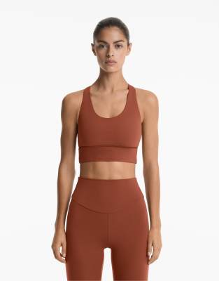 Oysho - Comfortlux - Brassière de sport à maintien intermédiaire avec bonnets - Marron rouge tuile