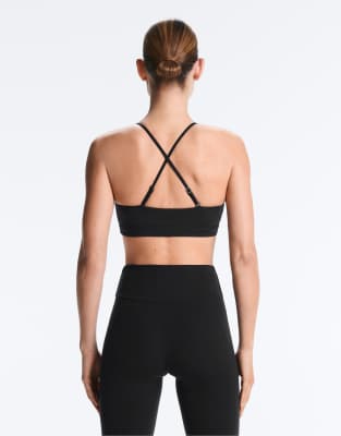Oysho - Comfortlux - Brassière de sport maintien léger avec bretelles croisées - Noir