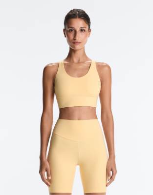Oysho - Comfortlux - Brassière de sport maintien modéré avec bonnets - Jaune pâle