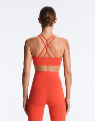 OYSHO Comfortlux light support sports bra with crossover straps in orange