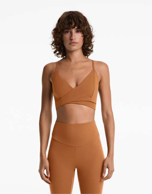 OYSHO - Comfortlux - Reggiseno sportivo a sostegno medio color arancione bruciato con fascette incrociate