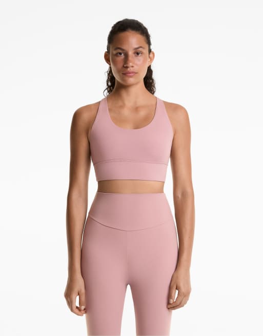 OYSHO– Comfortlux – Sport-BH in verwaschenem Rosé mit Körbchen und mittlerer Stützfunktion