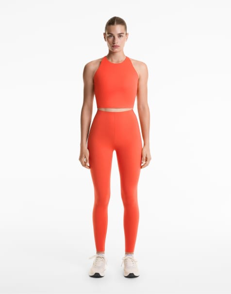 OYSHO Compressive reflective high rise ankle-length leggings in orange - view 1