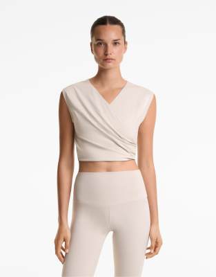 Oysho - Cropped-T-Shirt aus Baumwollmix in Hellrosa mit überkreuztem Detail