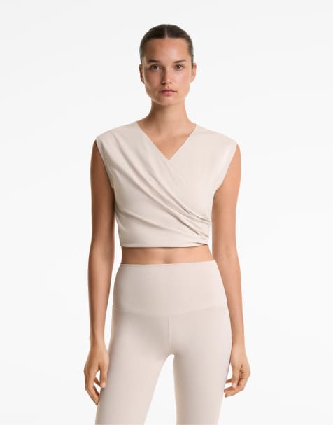 Oysho – Cropped-T-Shirt aus Baumwollmix in Hellrosa mit überkreuztem Detail - view 1