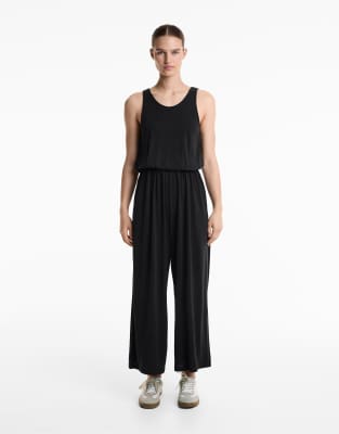 Oysho - Fließender Midi-Jumpsuit aus Modal in Schwarz mit überkreuztem Design am Rücken