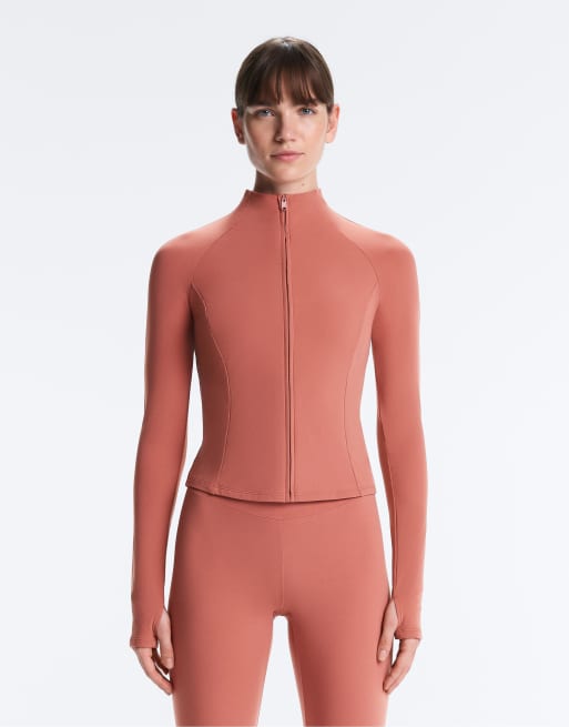 OYSHO - Giacca tecnica light warm color corallo