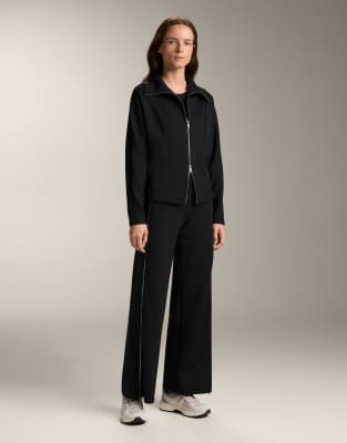 OYSHO - Hose in Schwarz mit hohem Bund, Reißverschluss und kontrastierendem Neopren-Effekt über die gesamte Länge