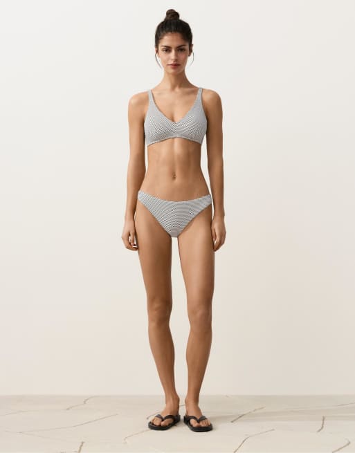 OYSHO Jacquard polka dot halter bikini top in white and black | ASOS
