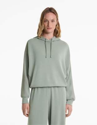 OYSHO - Kastiger Kapuzenpullover aus weichem Modal in Blaugrün mit geripptem Detail