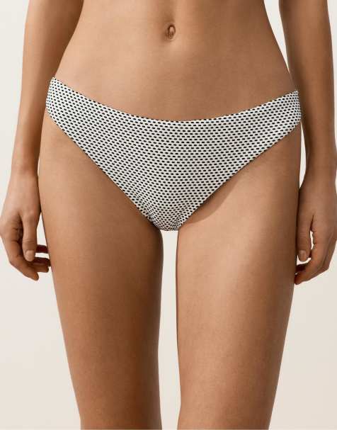 OYSHO – Klassische Bikinihose mit Jacquard-Punktemuster in Weiß und Schwarz - view 1