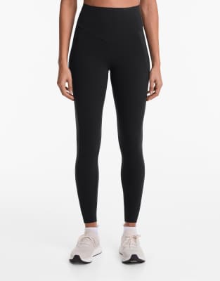 Oysho - Knöchellange Kompressions-Leggings in Schwarz mit Tasche und hohem Bund, 65 cm Schrittlänge
