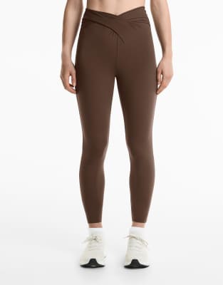 Oysho - Köchellange Leggings in Dunkelbraun aus leichtem Material mit Drapierung und V-förmigem Bund