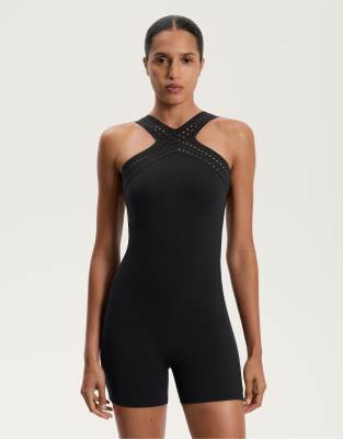 Oysho - Kurzer Kompressions-Jumpsuit in Schwarz mit Lochmuster
