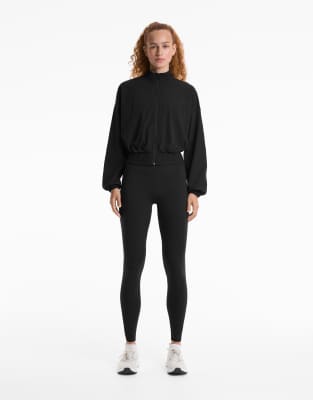 OYSHO - Langärmlige Funktionsjacke in Schwarz