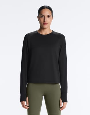 OYSHO - Langärmliges Funktions-T-Shirt in Schwarz