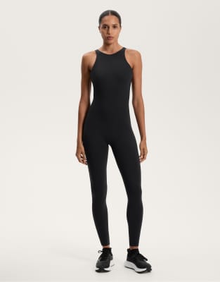 OYSHO - Langer Kompressions-Jumpsuit in Schwarz mit Riemchendesign am Rücken
