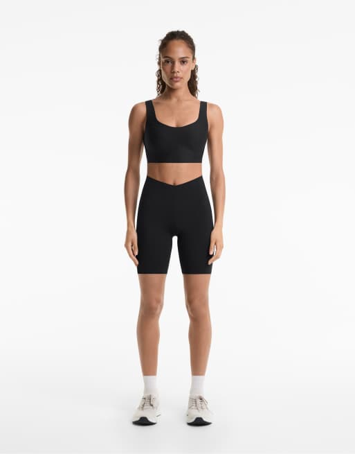 OYSHO - Leggings stile biker leggeri a vita alta da 20 cm neri con taglio a V