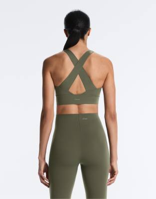 OYSHO Light touch medium-support crossover back bra in khaki-Green
