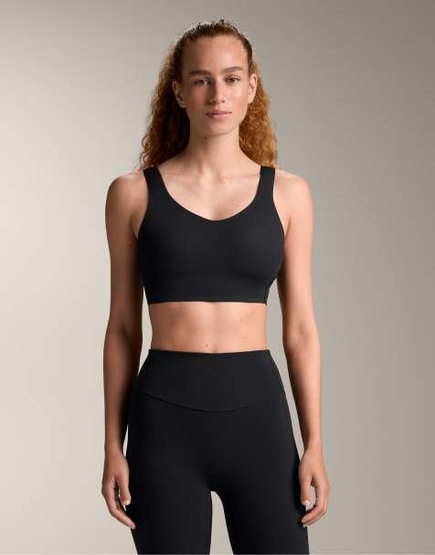 OYSHO Light touch medium-support sports bra in black