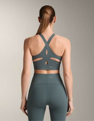 OYSHO Light touch medium-support sports bra in green