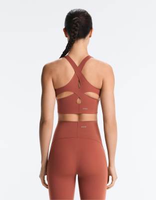 OYSHO Light touch medium-support sports bra in tile red