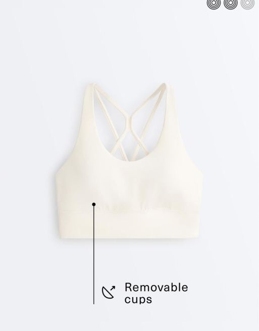 OYSHO Medium-support comfortlux sports bra with cups in pale ecru, 6 of 7