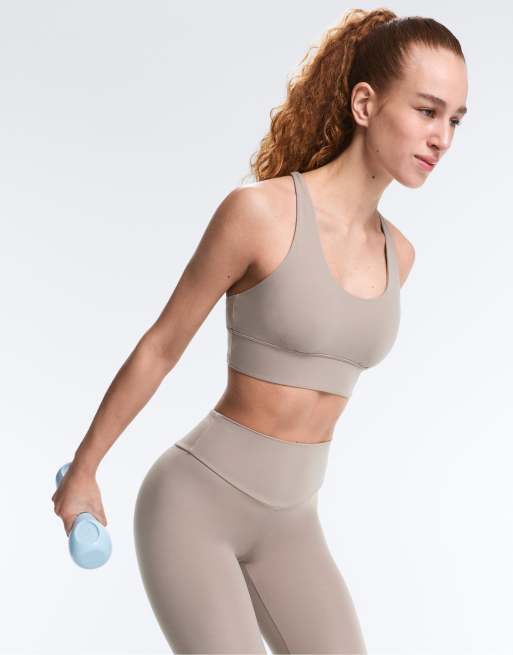 OYSHO Medium-support comfortlux sports bra with cups in pale taupe, 7 of 7
