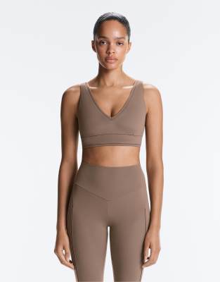 OYSHO Medium-support comfortlux sports bra with hemstitch in brown