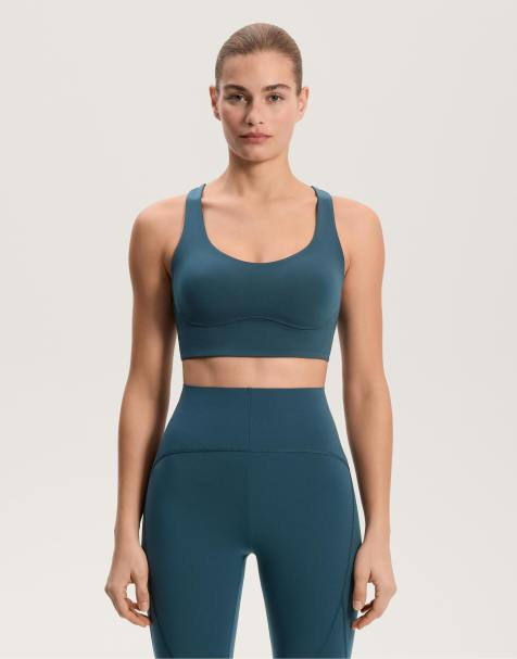 OYSHO Medium-support compressive bra with cups in dark ocean blue - view 1