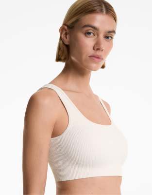 Oysho - Nahtloser, strukturierter Sport-BH in blassem Ecru-Neutral