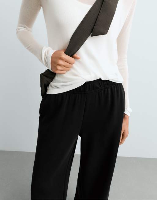 OYSHO - Pantaloni a fondo ampio neri in modal con profili a contrasto, 4 di 6
