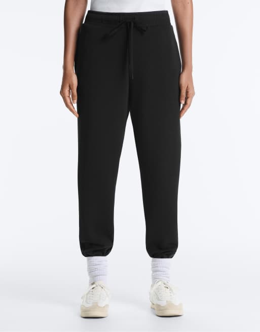 OYSHO - Pantaloni attillati neri con dettagli a coste e modal