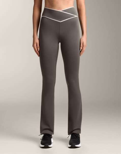 OYSHO Perfect-adapt crossover v-cut waist flare trousers in black - view 1