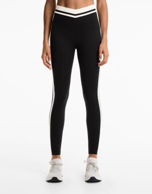 OYSHO - Perfect-Adapt - Knöchellange Leggings in Schwarz mit hohem Bund (65 cm) und Seitenstreifen