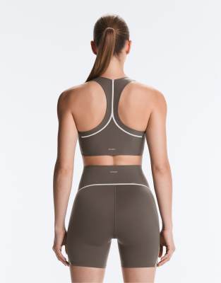 OYSHO Perfect-adapt reflective medium-support sports bra in black