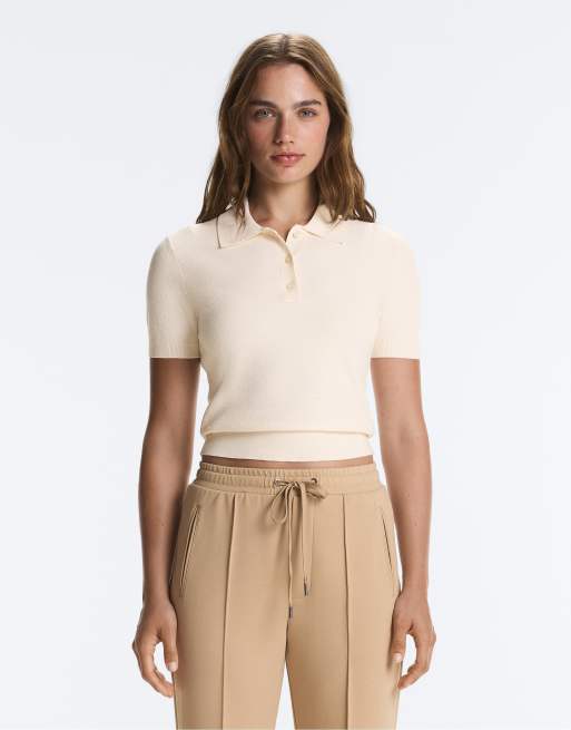 OYSHO polo in maglia a maniche corte con bottoni color ecru