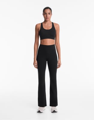 Oysho Raise up compressive 80cm flare trousers in black - view 1