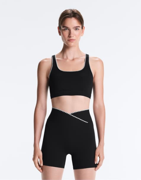 OYSHO - Reggiseno sportivo comfortlux a sostegno medio nero con cuciture a contrasto - view 1