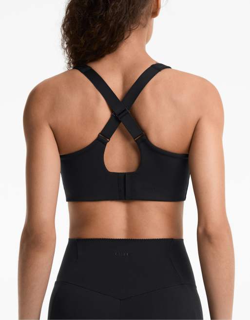 OYSHO - Reggiseno sportivo contenitivo nero incrociato sul retro a sostegno elevato