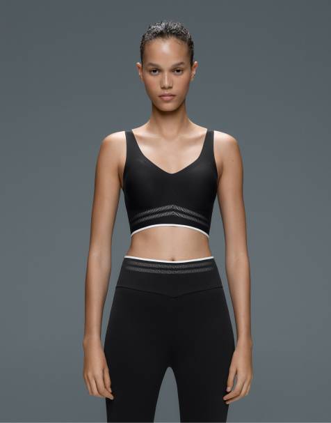 OYSHO reggiseno sportivo Perfect-adapt con sostegno medio e profili a contrasto nero - view 1